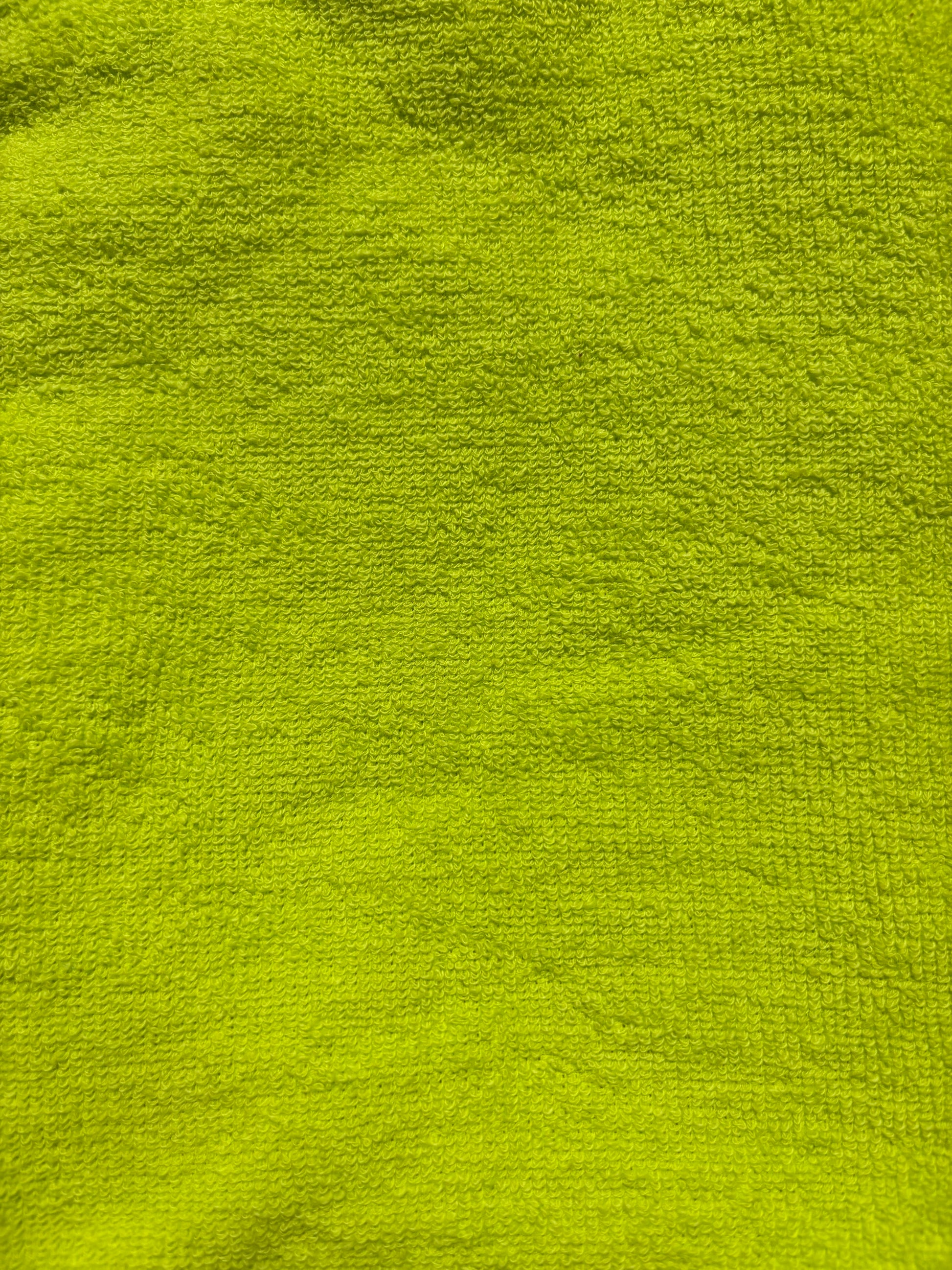 Close-up of bright green textured fabric